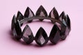 Black crystal crown on pink background Royalty Free Stock Photo