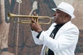 Black cuban musician playing the trumpet