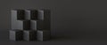 Black cube boxes with dark wall background Royalty Free Stock Photo