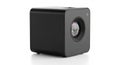 A black, cube-shaped digital projector with smooth, rounded edges is displayed. Royalty Free Stock Photo