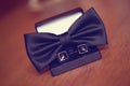 Black cuff links and bowtie Royalty Free Stock Photo