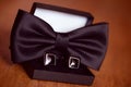 Black cuff links and bowtie Royalty Free Stock Photo