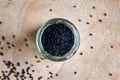 Black cumin seeds in a jar, top view Royalty Free Stock Photo