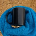 Black cup with lace blue scarf