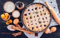 Black currant and apricot pie with ingredients Royalty Free Stock Photo