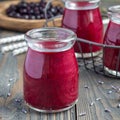 Black currant, greek yogurt, honey and lavender smoothie in glass jar, square format Royalty Free Stock Photo