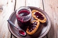 Black currant jam in glass jar and crackers Royalty Free Stock Photo