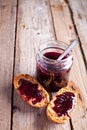 Black currant jam in glass jar and crackers Royalty Free Stock Photo