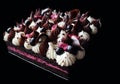 Black currant mousse sheet cake with whipped cream topping and fresh berries Royalty Free Stock Photo