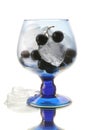 Black currant in the wineglass with an ice