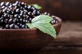 Black currant on a wooden background Royalty Free Stock Photo