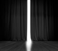 Black curtain background with bright light behind Royalty Free Stock Photo