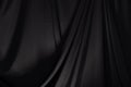 Black Curtain drape wave with studio lighting Royalty Free Stock Photo