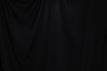 Black Curtain drape wave with studio lighting Royalty Free Stock Photo