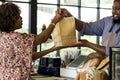 Black customer buying bakery products