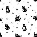 Black cute cats on a white background. Seamless pattern. Royalty Free Stock Photo