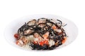 Black cuttlefish spaghetti with tomato sauce and parmesan Royalty Free Stock Photo