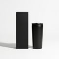 Black cylindrical container and matching box on a white background Royalty Free Stock Photo