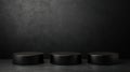 Black cylindrical podiums on dark textured background Royalty Free Stock Photo