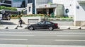 Black 320d sedan F30 car moving on the street. Side view of BMW 3 Series auto driving on the road with city background Royalty Free Stock Photo