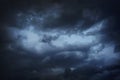 Black dark blue gray sky with clouds. Dramatic background. Storm hurricane wind rain cloudy. Ominous scary creepy. Royalty Free Stock Photo