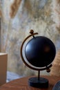 Black decorative globe. The subject of the interior in the style of minimalism.An interesting solution for home and