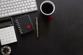Black desk office with laptop, smartphone and other work supplies with cup of coffee. Top view with copy space for input the text Royalty Free Stock Photo