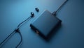 Black MP3 Player and Earphones on Blue Background Royalty Free Stock Photo