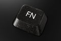 Black diamond keyboard button with FN word on black background. Royalty Free Stock Photo