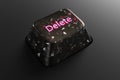 Black diamond keyboard button with neon word Delete on black background. Royalty Free Stock Photo