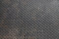 black diamond metal plate background, grunge texture of dark metallic sheet with small oval shape diagonal pattern Royalty Free Stock Photo