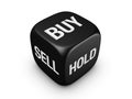 Black dice with buy, sell, hold sign