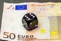 Black dice poker is on a banknote fifty euros