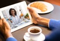 Black dietologist lady consulting patient online via video call on digital tablet