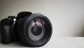 Black digital camera isolated on a light background Royalty Free Stock Photo