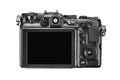 Black digital compact photo camera with blank LCD and buttons. Rear view, isolated on white Royalty Free Stock Photo