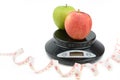 Black digital scale, weight green apple Royalty Free Stock Photo