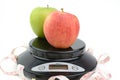 Black digital scale, weight green apple Royalty Free Stock Photo