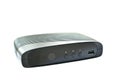 Black digital television set top box receiver with plug in on white background Royalty Free Stock Photo