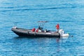 Black Dinghy and a Unicorn shaped Ring Buoy - Mediterranean Sea Italy Royalty Free Stock Photo