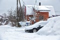 Black dirty car under the snow. Drifts above the car. Heavy snowfall. Frozen car in snowdrift. winter problems to start engine Royalty Free Stock Photo