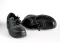 Black and dirty pair of children`s shoes