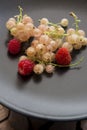 Black dish with freshly  sweet berries Royalty Free Stock Photo