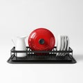 Black Dish Rack with White Pitcher, Red Pot, and Stacked Plates on White Background kitchenware Royalty Free Stock Photo