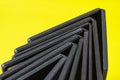 Black disk boxes in the shape of an arrow on a yellow background Royalty Free Stock Photo