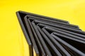 Black disk boxes in the shape of an arrow on a yellow background Royalty Free Stock Photo