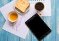 Black display Tablet , Toast , Honey , Coffee cup , Graph data a Royalty Free Stock Photo