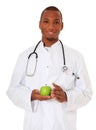 Black doctor holding green apple Royalty Free Stock Photo