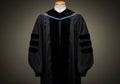 Black Doctoral Graduation Gown with Green and Red Trim Royalty Free Stock Photo
