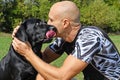 Black dog give kiss man Royalty Free Stock Photo